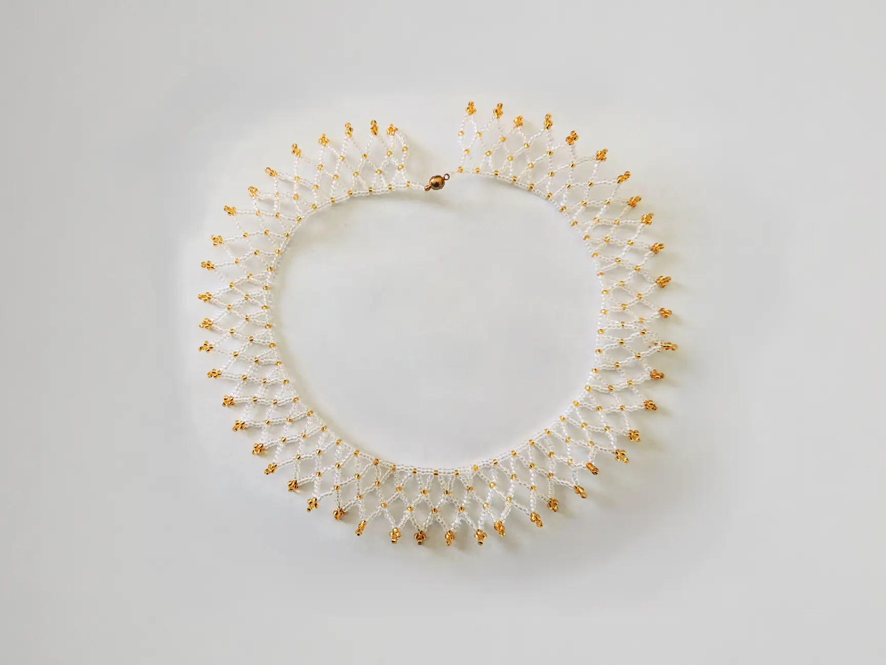 collier dentelle christal et or